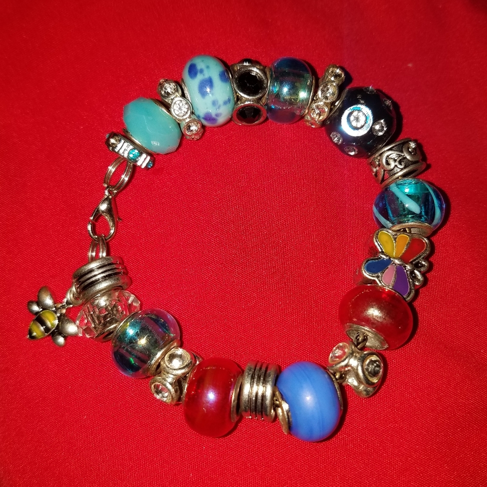 A blue and red murano glass charm bracelet